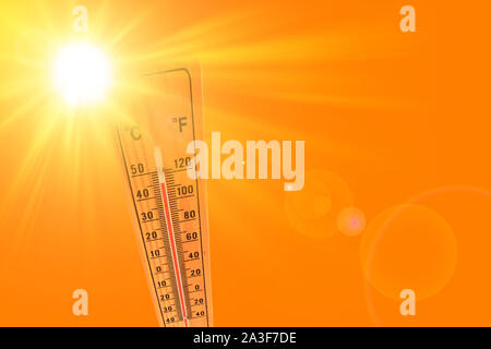 Orange illustration representing the hot summer sun and the environmental thermometer that marks a temperature of 45 degrees Stock Photo
