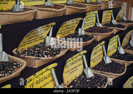 Herbalist shop in Seville, Spain. Different types of tea in basket. Selective focus. Stock Photo