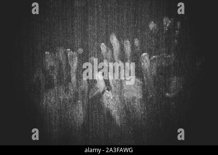 Hand marks on wooden wall / hand prints Horror scary dirty fingerprint The concept of loneliness and abandonment and Horror scary Ghost in home door o Stock Photo