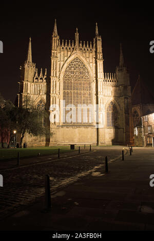 Night time image of the illuminated  East Front of York Minster showing the exterior of the East Window taken from College Street, York. Stock Photo