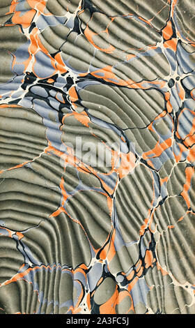 Hand marbled pastedown or endpaper from 19th century book binding featuring the Spanish moiré technique (Turkish pattern with a wave effect pattern). Stock Photo