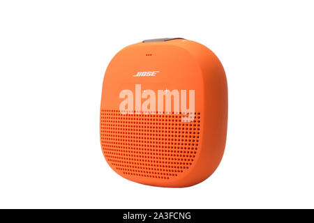 An orange wireless speaker isolated on white Stock Photo