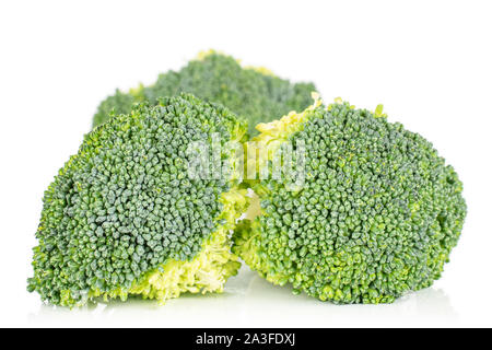 Group of three whole fresh green broccoli isolated on white background Stock Photo