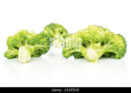 Group of three whole arranged fresh green broccoli isolated on white background Stock Photo