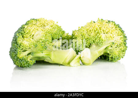 Group of two whole fresh green broccoli isolated on white background Stock Photo