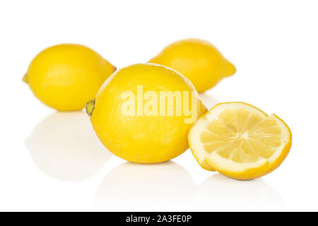 Group of three whole two pieces of fresh yellow lemon isolated on white background Stock Photo
