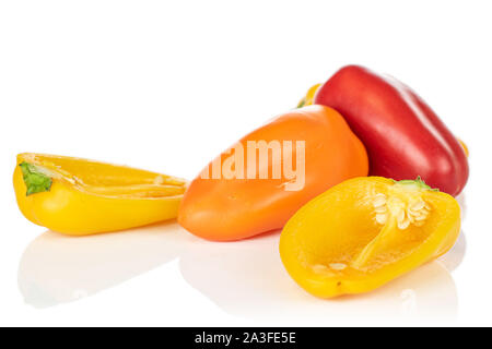 Group of three whole one half of fresh pepper isolated on white background Stock Photo
