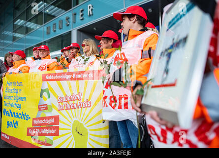 08 October 2019, North Rhine-Westphalia, Greven: Employees of cleaning companies on strike at Münster Osnabrück airport. The cleaners started a 24-hour warning strike on Tuesday with the early shift at 6 a.m. This was the union's reaction to the deadlocked negotiations on a framework wage agreement for the cleaning trade, a spokesman for IB BAU said. Air traffic is likely to be affected because aircraft are not allowed to take off without cleaning. Parallel campaigns are underway at Frankfurt and Berlin Tegel airports. The union is also planning a demonstration for NRW at Düsseldorf airport t Stock Photo