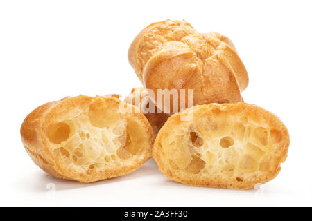 Group of two whole two halves of baked golden profiterole isolated on white background Stock Photo