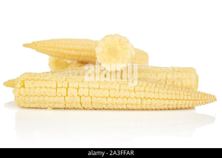 Lot of whole baby yellow corn isolated on white background Stock Photo