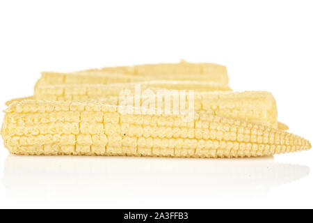Lot of whole baby yellow corn isolated on white background Stock Photo