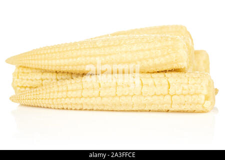 Lot of whole baby yellow corn heap isolated on white background Stock Photo