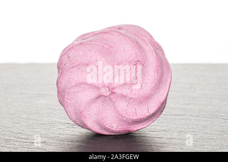 One whole rose fresh pastel zefir on grey stone isolated on white background Stock Photo
