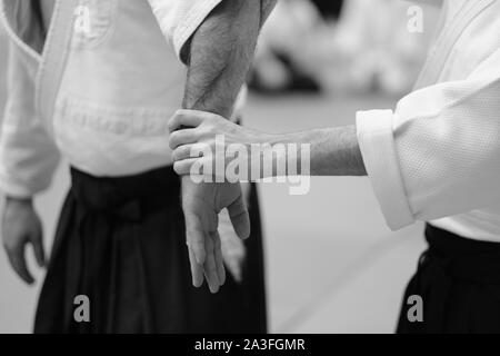 The study of the position of the hands when practicing the techniques of single combat in aikido Stock Photo