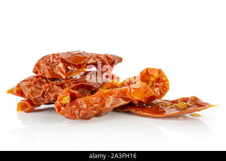 Lot of slices of dry red cherry tomato isolated on white background Stock Photo