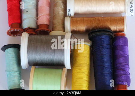 Reels of thread of different colors for sewing Stock Photo