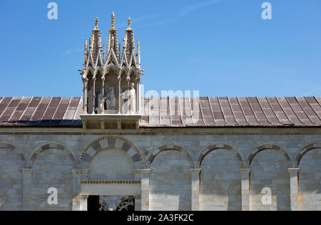 A detail of the marble facade and gothic statues above the entrance to the Camposanto on the Campo Dei Miracoli in Pisa. Stock Photo