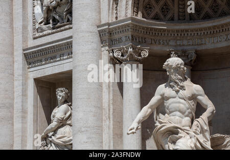 Detail of the two statues Oceanus (in the centre of the fountain) and Abundance on the famous Trevi Fountain, a major tourist attraction in Rome. Stock Photo