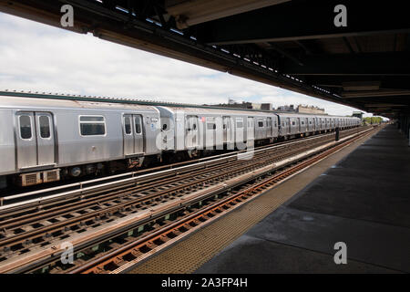 F train at 18th street subway station in Brooklyn NYC Stock Photo