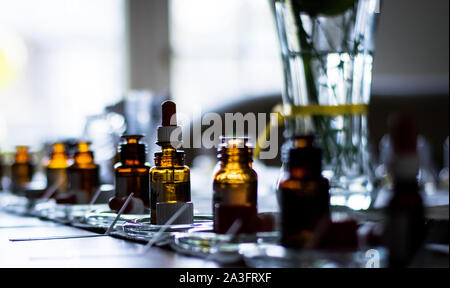Perfume bottles in a row on a table Stock Photo