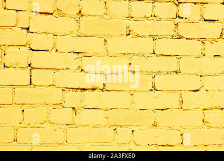 Painted brick wall in yellow or living coral color background texture, empty space for your design Stock Photo