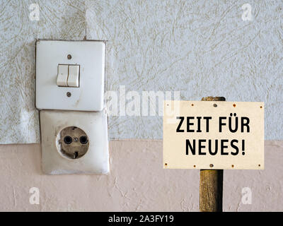 Old light switch with socket and shield Stock Photo