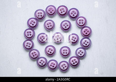 purple sewing  buttons isolated on white background. Stock Photo