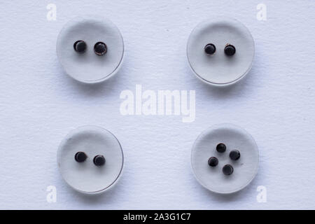 white sewing buttons on white. Stock Photo