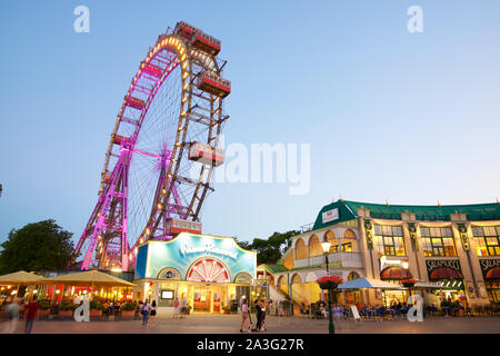 Vienna, Austria - June 25, 2019: Tourists visiting Ferris wheel of Vienna Prater Park. Place where scenes from the movie The Third Man were filmed. Stock Photo