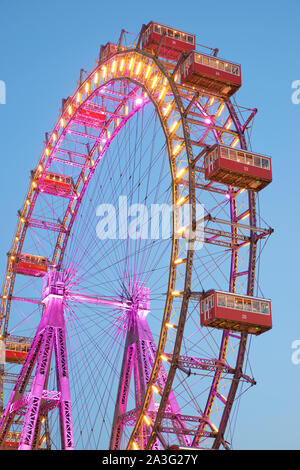 Vienna, Austria - June 25, 2019: Tourists visiting Ferris wheel of Vienna Prater Park. Place where scenes from the movie The Third Man were filmed. Stock Photo