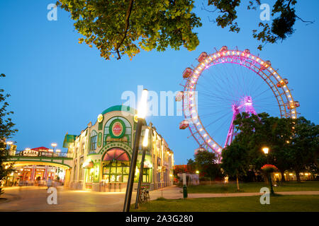 Vienna, Austria - June 25, 2019: Tourists visiting Ferris wheel of Vienna Prater Park. Place where scenes from the movie The Third Man were filmed. Stock Photo