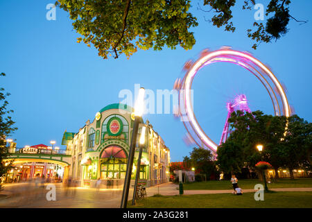 Vienna, Austria - June 25, 2019: Tourists visiting Ferris wheel of Vienna Prater Park. Place where scenes from the movie The Third Man were filmed. Stock Photo