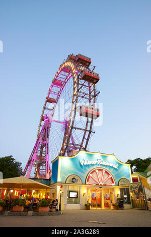 Vienna, Austria - June 25, 2019: Tourists visiting Ferris wheel of Vienna Prater Park. Place where scenes from the movie The Third Man were filmed. Stock Photo
