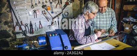 Senior couple in a carpentry Stock Photo