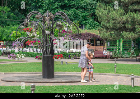 Odessa, Ukraine - 06.09.2019. People spend their families relaxing by the fountain in Gorky Park in Odessa, Ukraine, on a sunny summer day Stock Photo