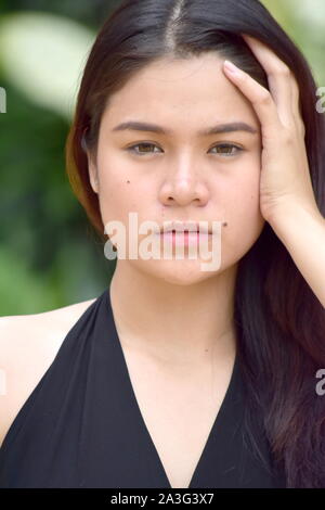 A Forgetful Pretty Filipina Woman Stock Photo