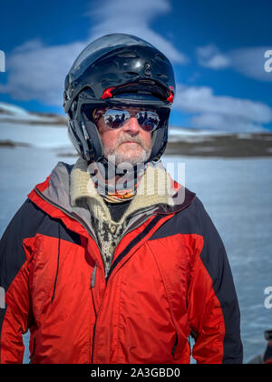Portrait -man wearing a helmet.The Glaciological Society trip, Mt. Kerlingafjol, Hofsjokull Ice Cap, Central Highlands, Iceland Stock Photo