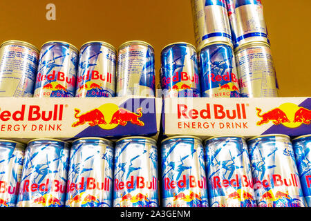 Red Bull cans energy drink Supermarket shelf Stock Photo