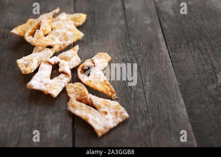 Fat Thursday. Traditional shortbread sweets with powdered sugar. Stock Photo