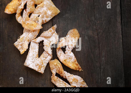 Angel wings.Traditional shortbread crepes with powdered sugar, regional carnival sweets. Stock Photo