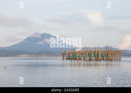 Philippines, Palawan, Malampaya Sound Protected Landscape and Seascape, typical fishing gear with a bamboo structure maintaining fish nets Stock Photo