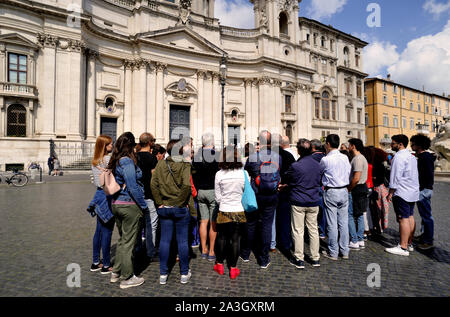 Italy, Rome, Piazza Navona, church of Sant'Agnese in Agone and tourist group Stock Photo