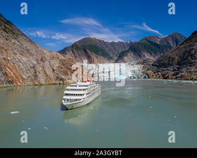 USA, Alaska, Tracy Arm - Fords Terror Wilderness, Aerial view of cruise ship M/S American Constitution motoring near Sawyer Glacier in Tracy Arm on su Stock Photo