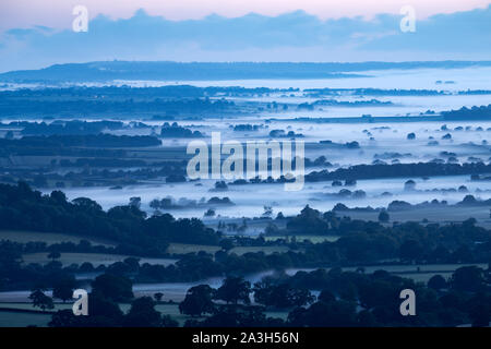 Dawn on the longest day in the Blackmore Vale, from Okeford Hill, Dorset, England, UK Stock Photo