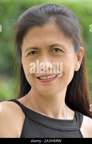 A Smiling Old Filipina Female Senior Stock Photo - Alamy