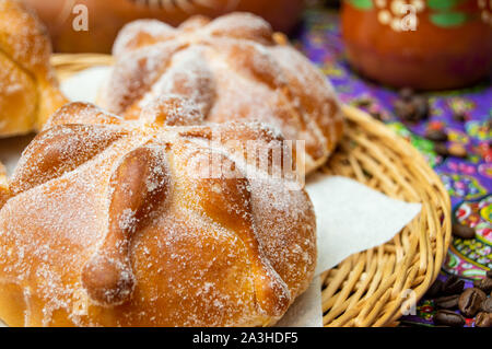 Traditional Mexican bread of the dead (pan de muerto) served with coffee from the pot (cafe de olla), this bread is made around the day of the dead ce Stock Photo