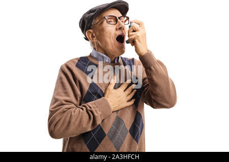 Senior man with asthma using an inhaler isolated on white background Stock Photo