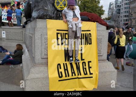 Environmental activists protest about Climate Change during an occupation of Trafalgar Square in central London, the second day of a two-week prolonged worldwide protest by members of Extinction Rebellion, on 8th October 2019, in London, England. Stock Photo