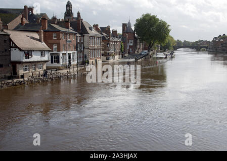 The over flowing waters of the River Ouse in York UK starting to recede from Kings Staith Landing taken from Ouse bridge central York Stock Photo