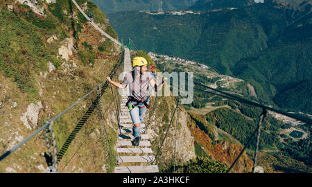 rope bridge in mountains Stock Photo